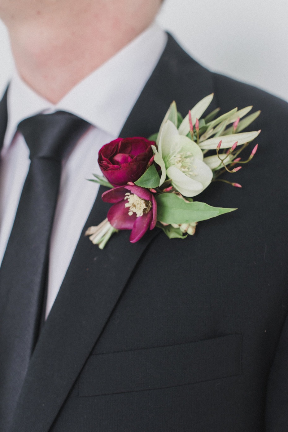 Maroon and white floral boutonniere