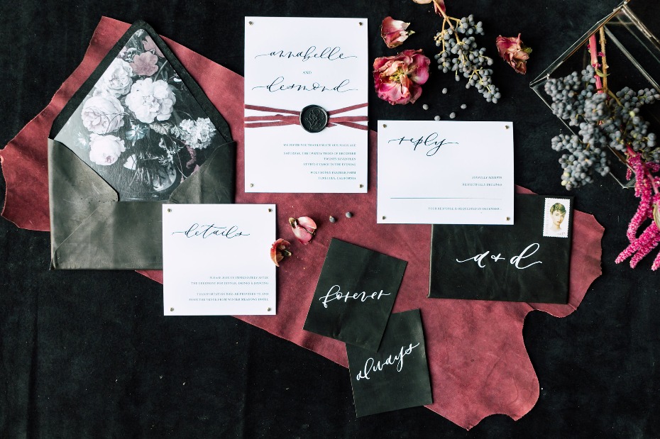Leather and floral invitation suite