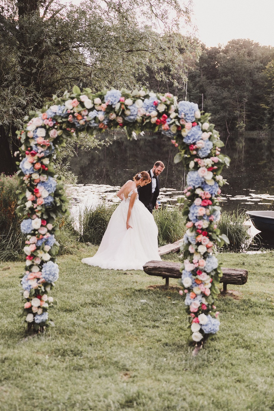 Elegant wedding ceremony arch with couple on a beautiful day