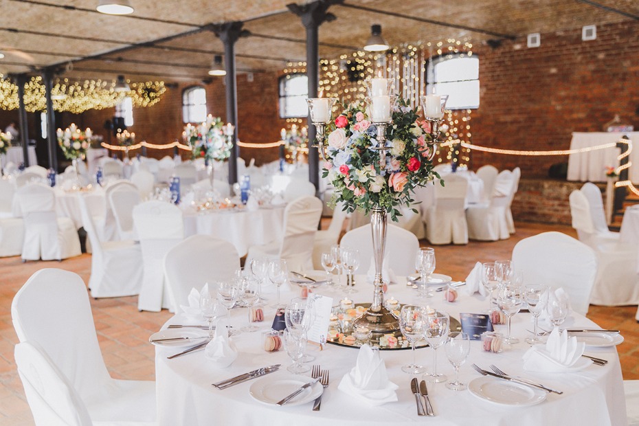 Elegant wedding reception tables with floral centerpieces