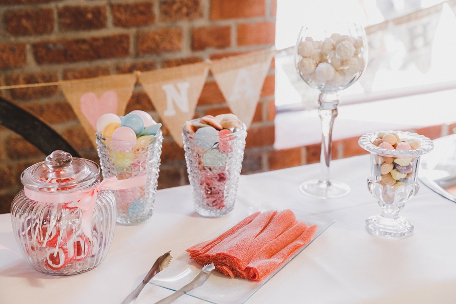 Candy buffet with vintage jars and pink ribbon, party decor