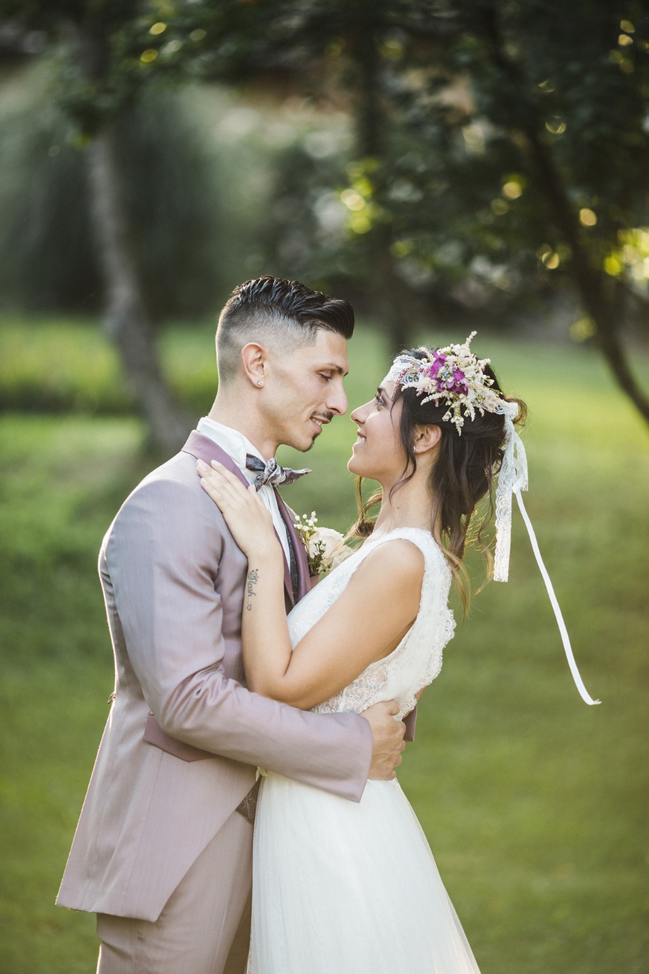 Happy bride and groom embracing outdoors