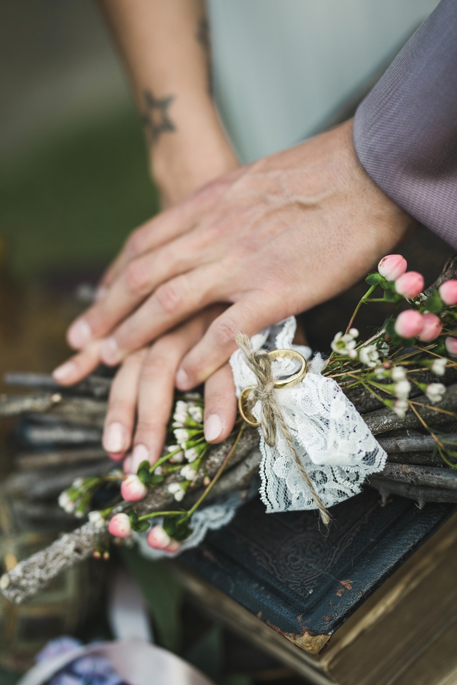 Wedding rings on rustic twig bouquet