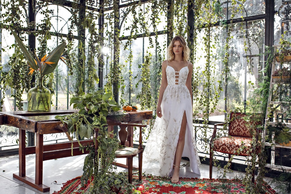 A beautiful bride in a garden-themed wedding dress