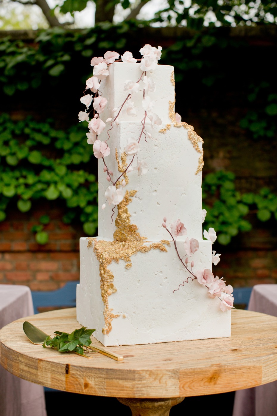 Asymmetrical wedding cake with aged rough stone fondant