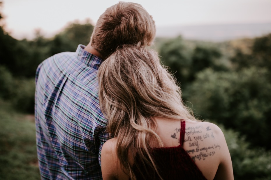 A couple embracing with woman leaning on man, a moment of love