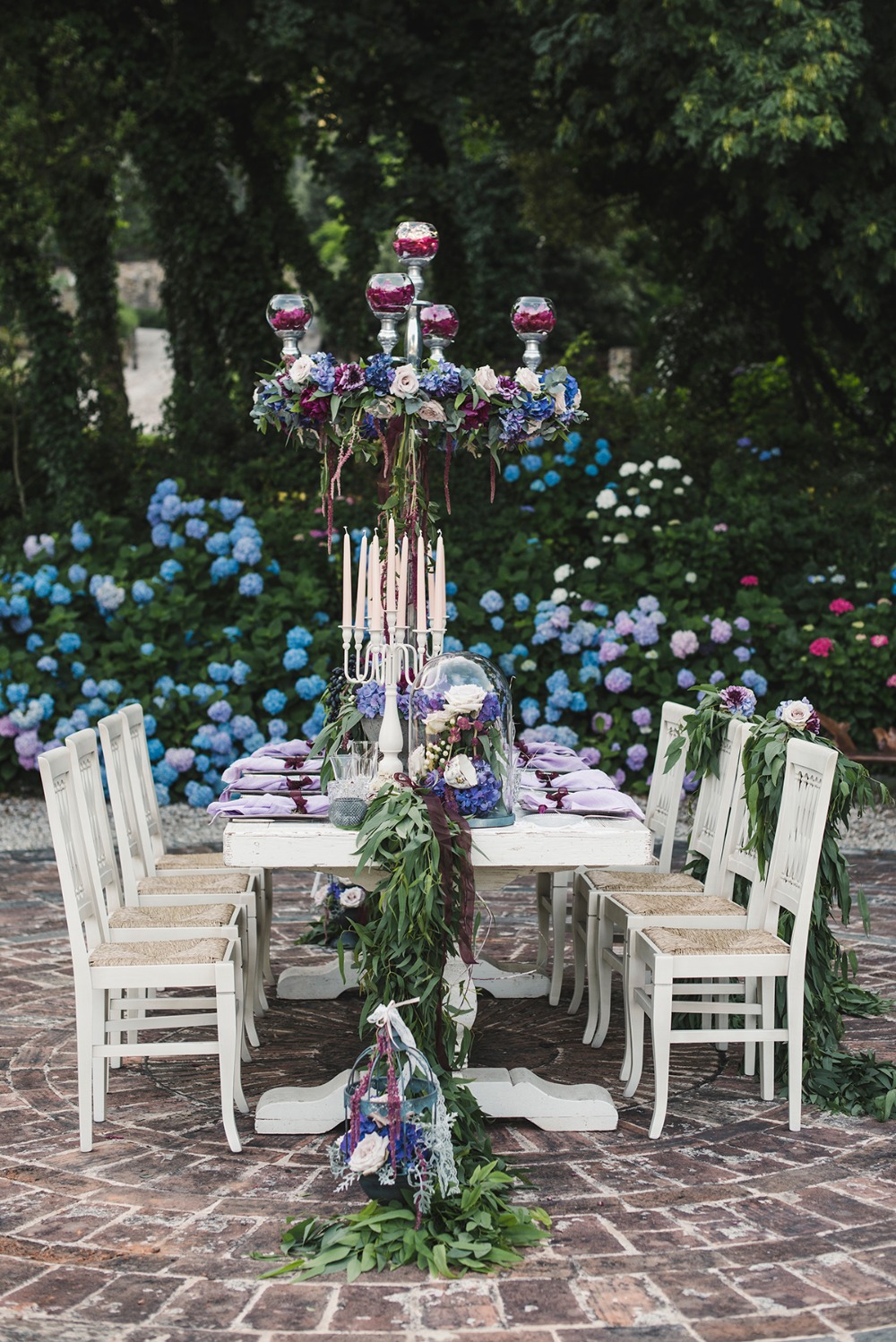 Elegant outdoor wedding table with floral centerpiece