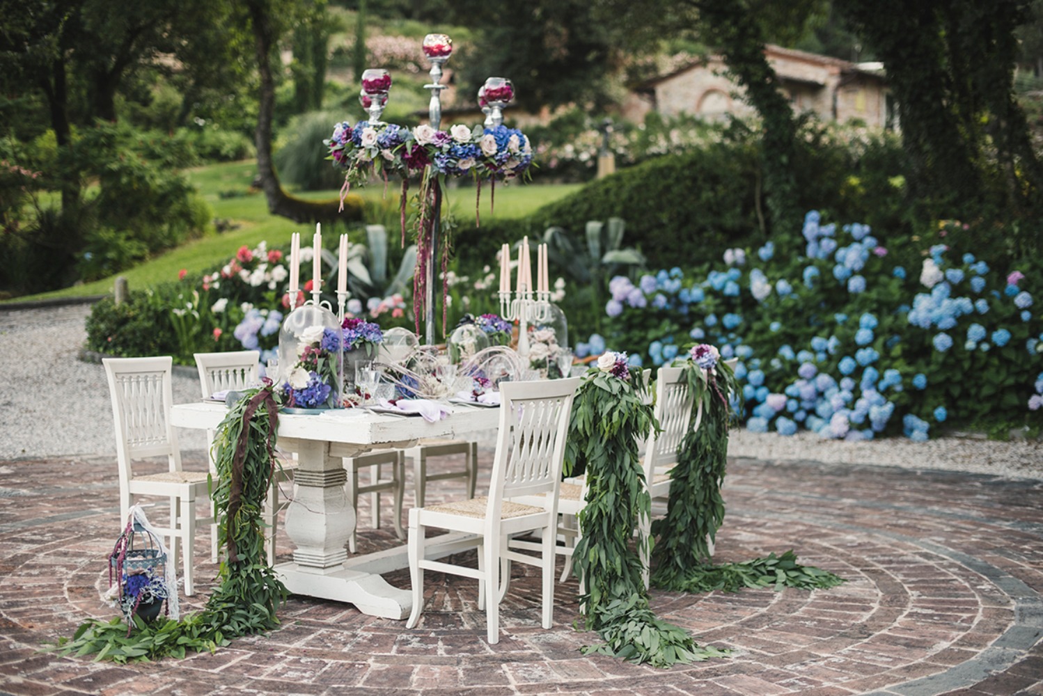 Outdoor wedding reception table with floral decorations