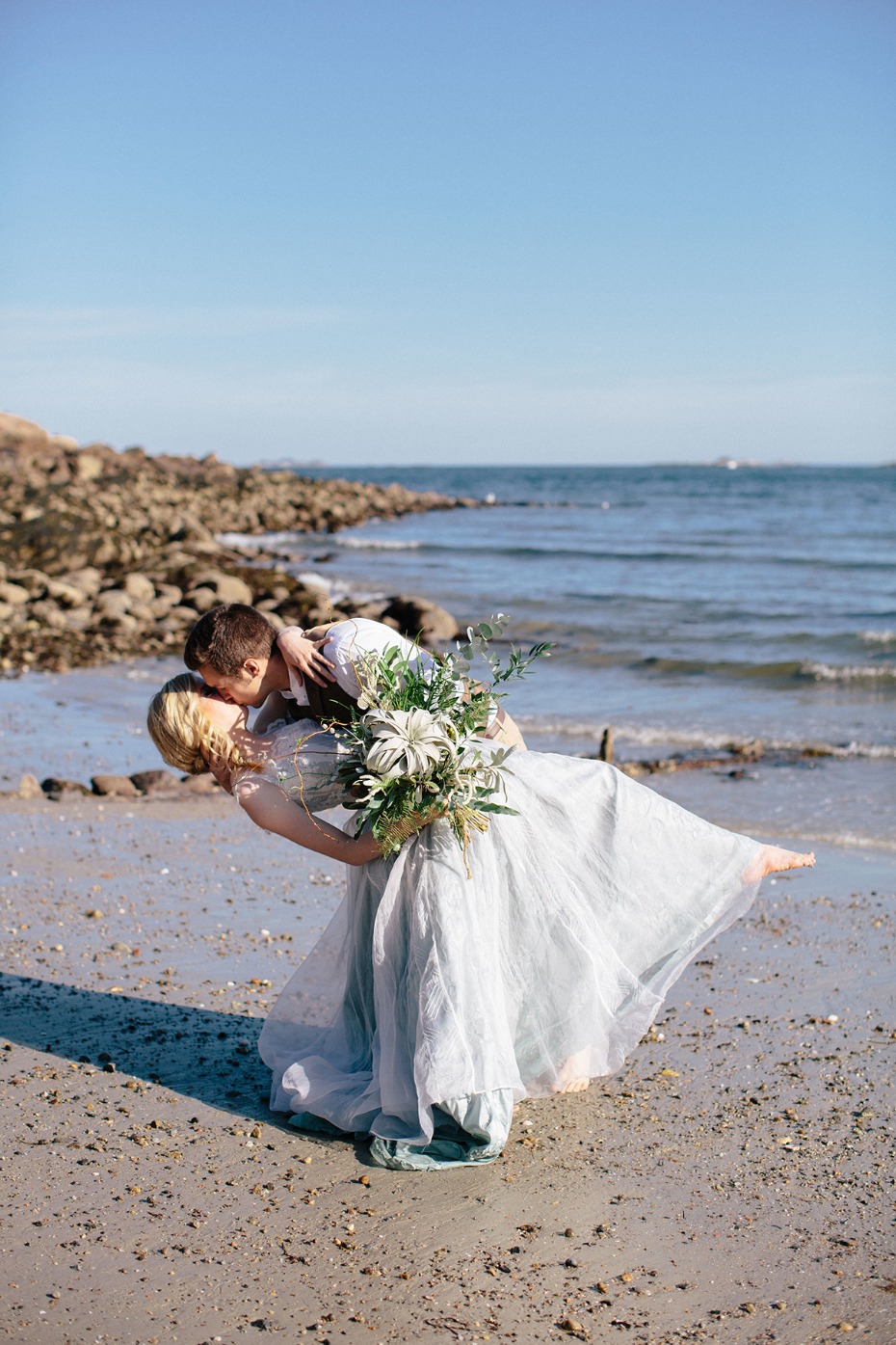 wedding dip kiss on the beach