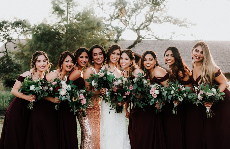 Bridesmaids in burgundy and gold