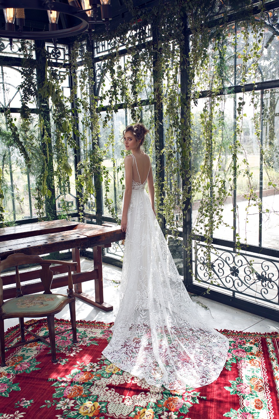 Elegant bride in a lace wedding dress in a garden setting