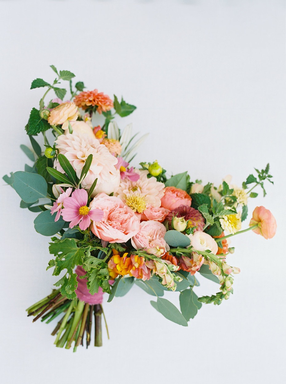 Elegant wedding bouquet with peach and pink flowers