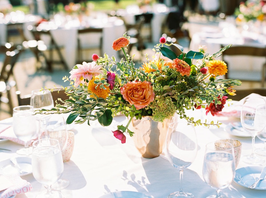 Elegant floral centerpiece at outdoor wedding reception