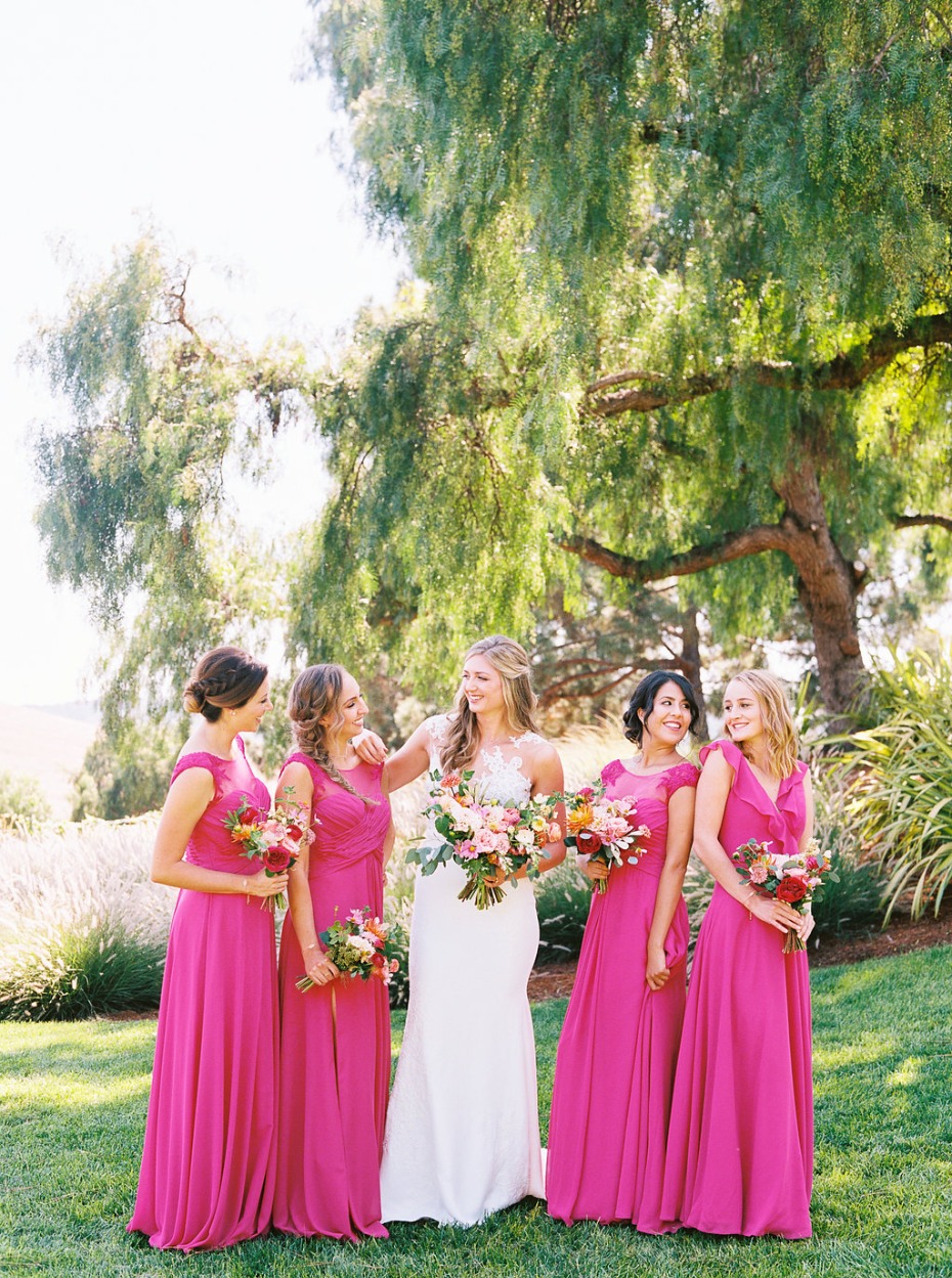Bridesmaids in bright pink dresses