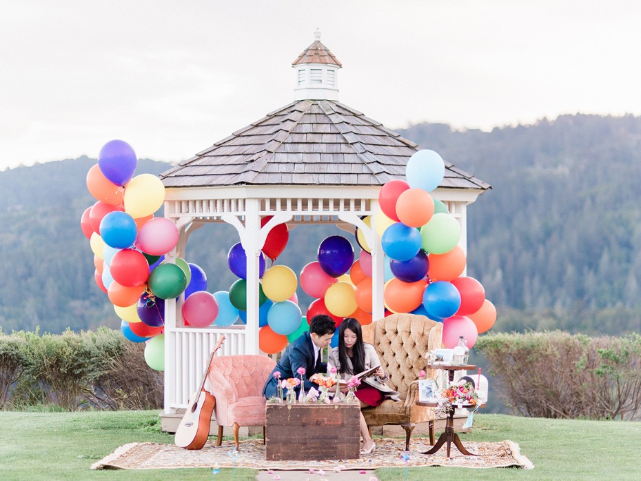 wedding proposal with rainbow balloons