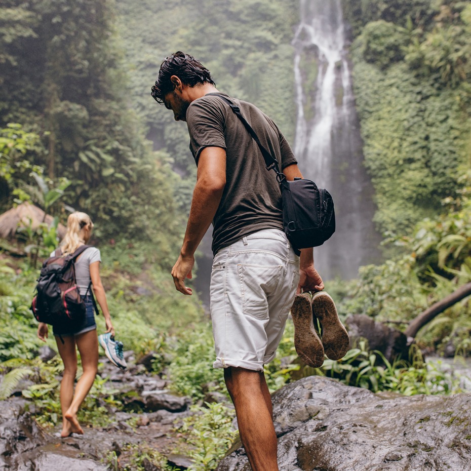 VEBO Experience Registry Couple Hiking Near Waterfall