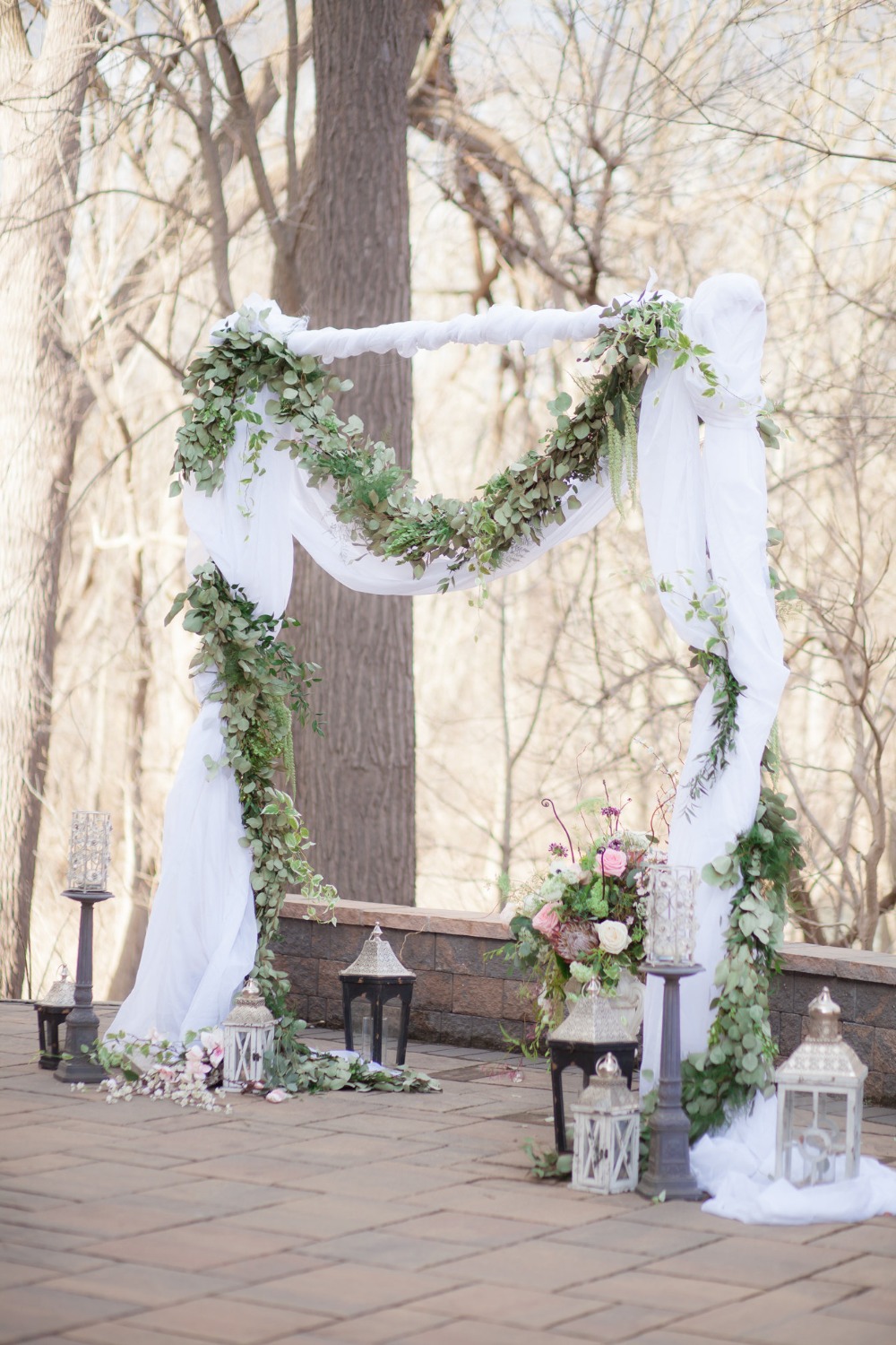 romantic greenery garland accented wedding arch
