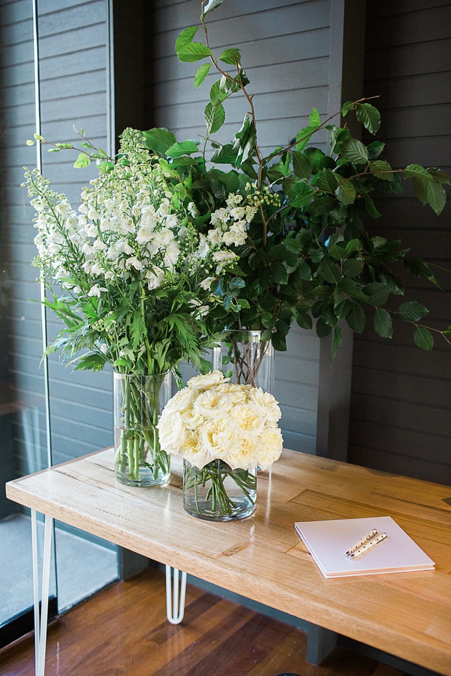 Elegant floral arrangement with white flowers on wooden table