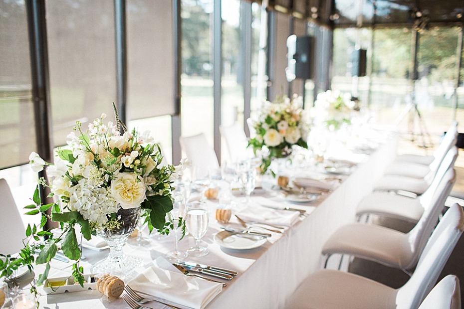 Elegant wedding reception table with flower arrangements