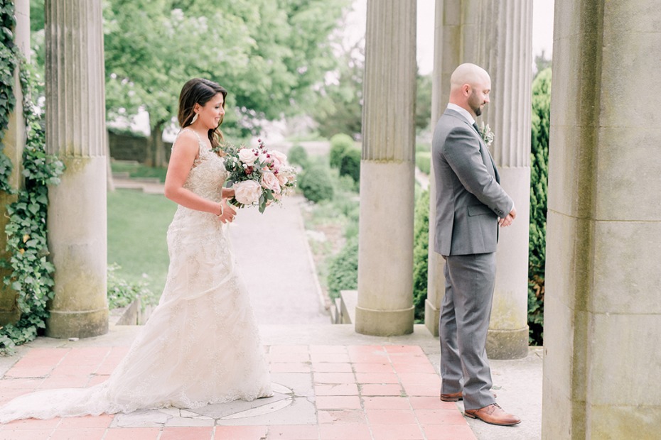 Bride approaches groom for first look, wedding day moment