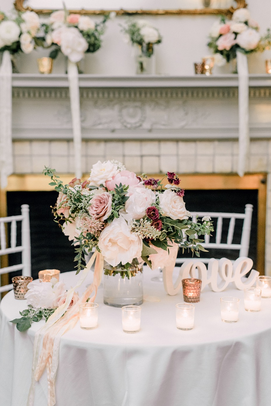 Romantic wedding table with flowers and candles for ceremony decor