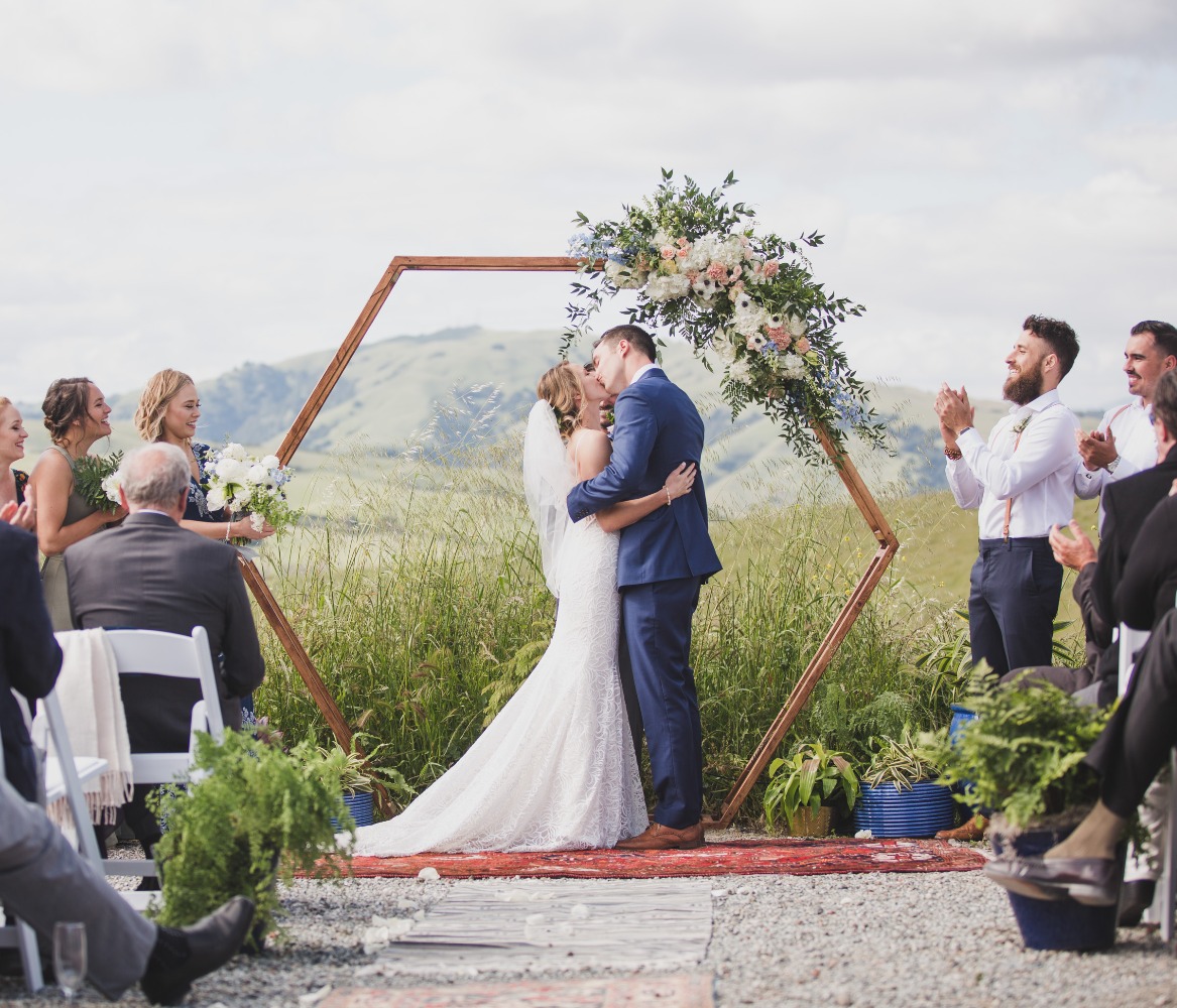 hexagon wedding arch backdrop with florals
