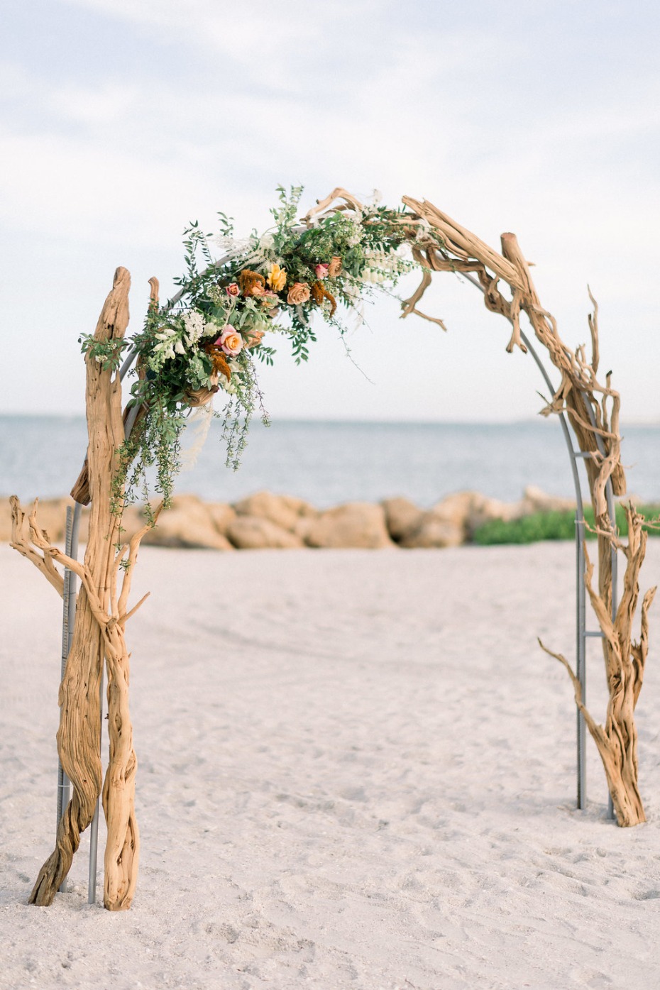 driftwood and floral wedding arch