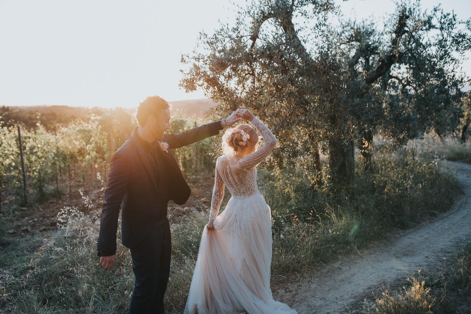 Bride and groom twirling in Tuscany Italy Planned by Wed in Florence