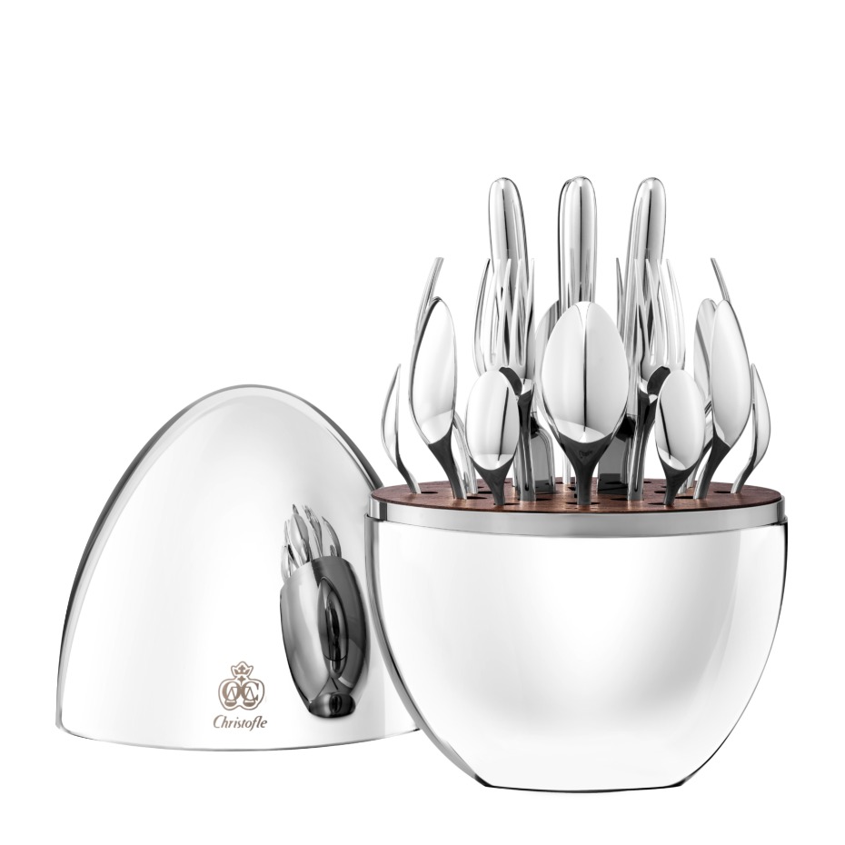 Elegant Christofle silverware set displayed in a decorative silver case
