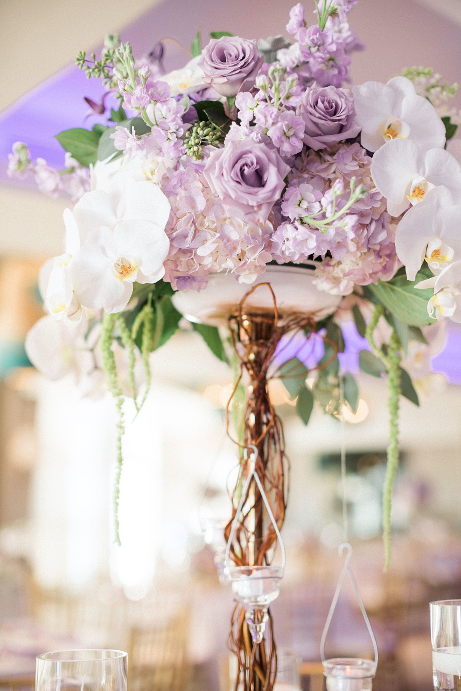 purple and white pedestal floral centerpieces