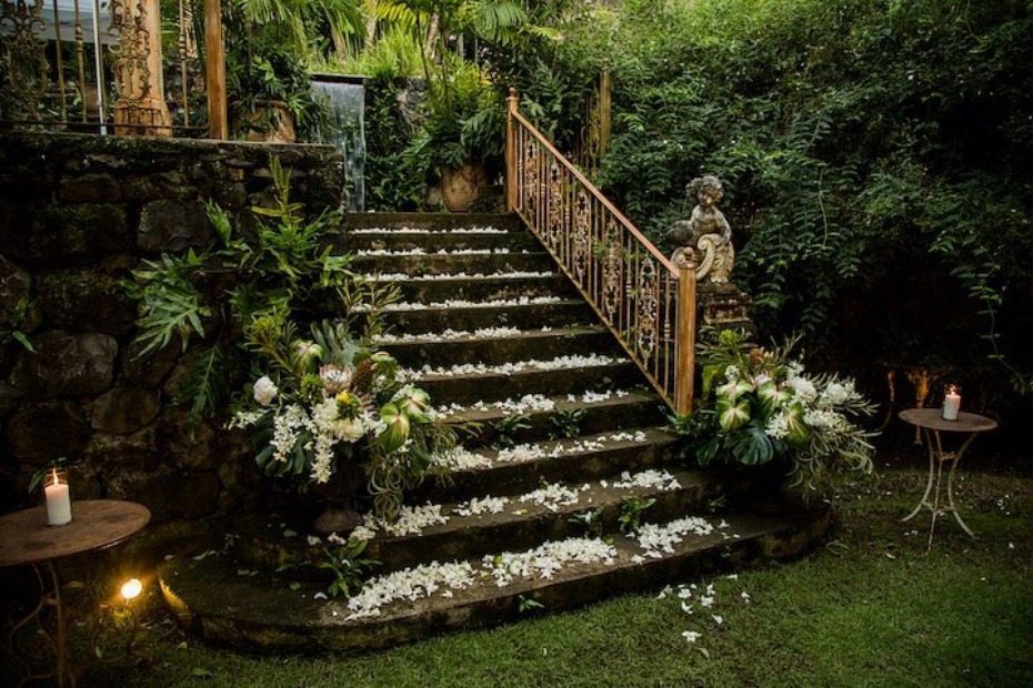 Elegant garden staircase decorated with flowers and candles