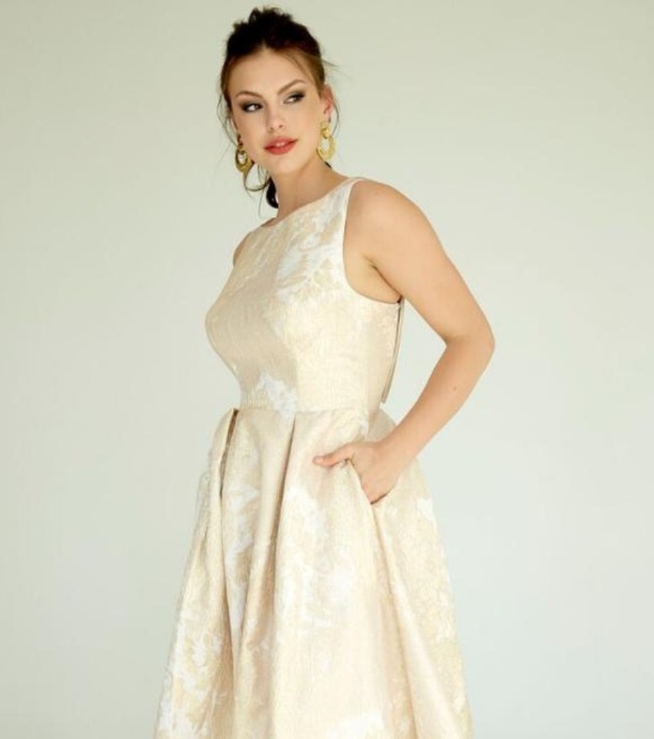 Elegant woman in a champagne brocade dress