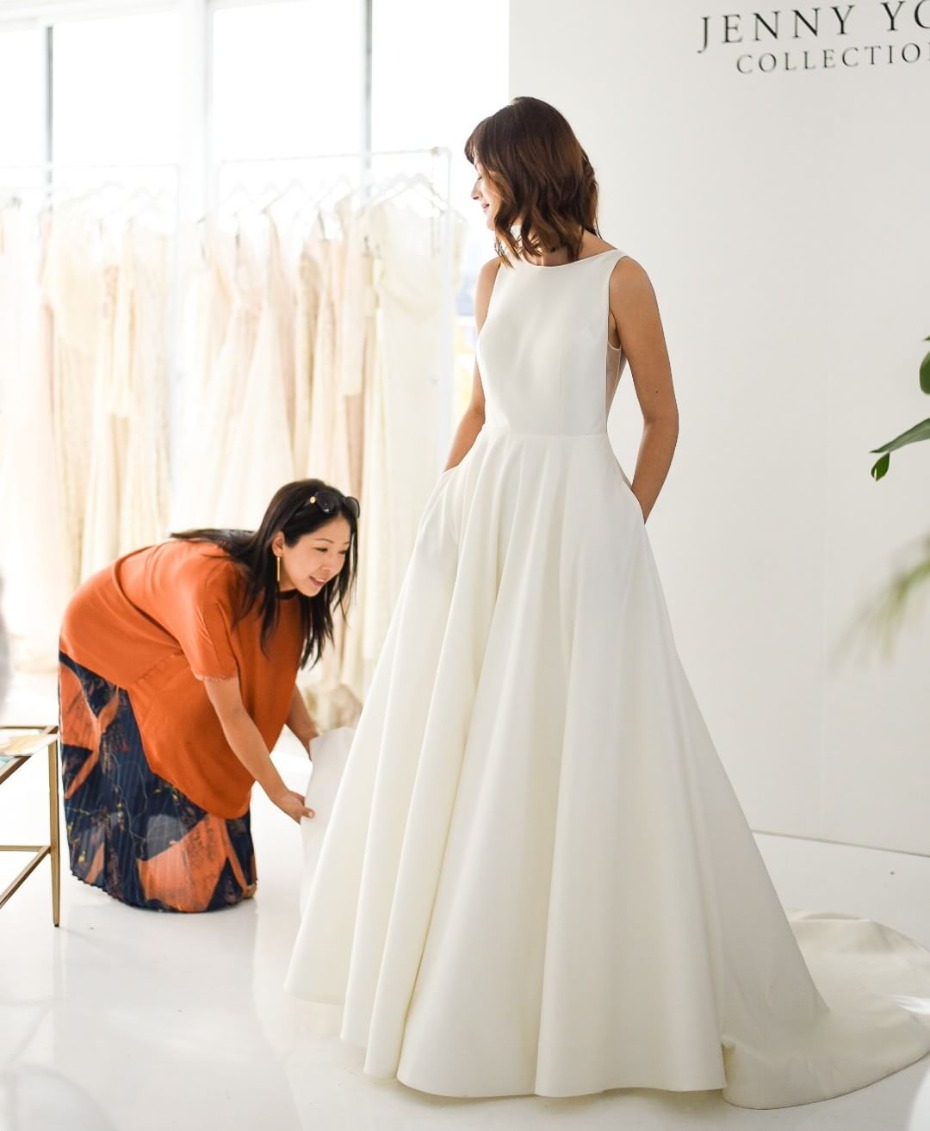 Bride trying on Jenny Yoo Collection wedding gown