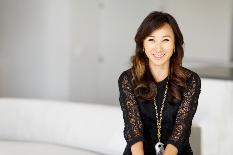 Smiling Asian woman in a black dress, perfect for professional websites
