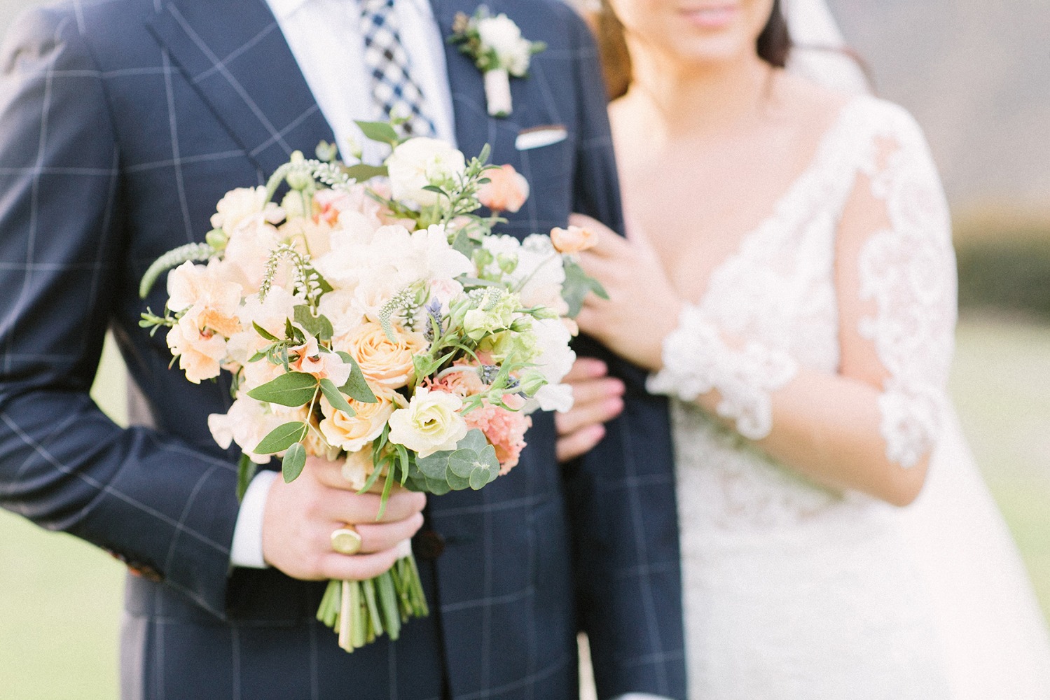 navy checkered suit and bouquet