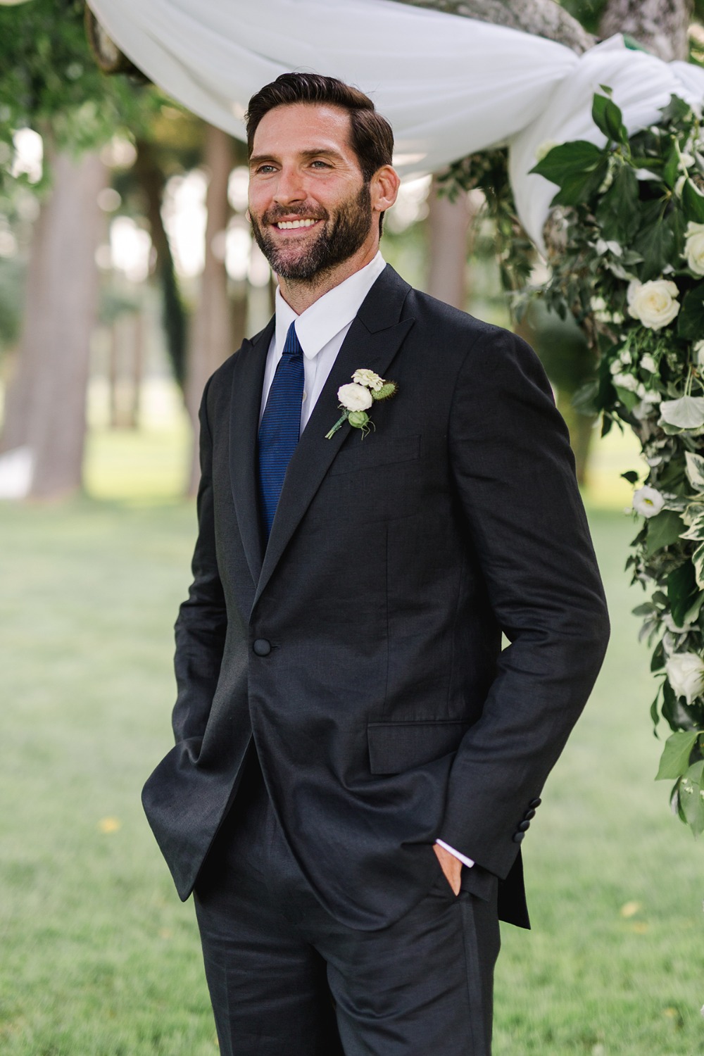 groom in black and royal blue