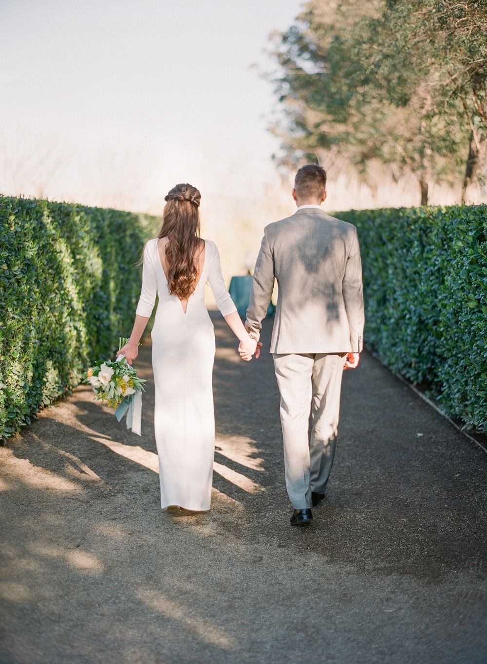 wedding couple walking hand in hand