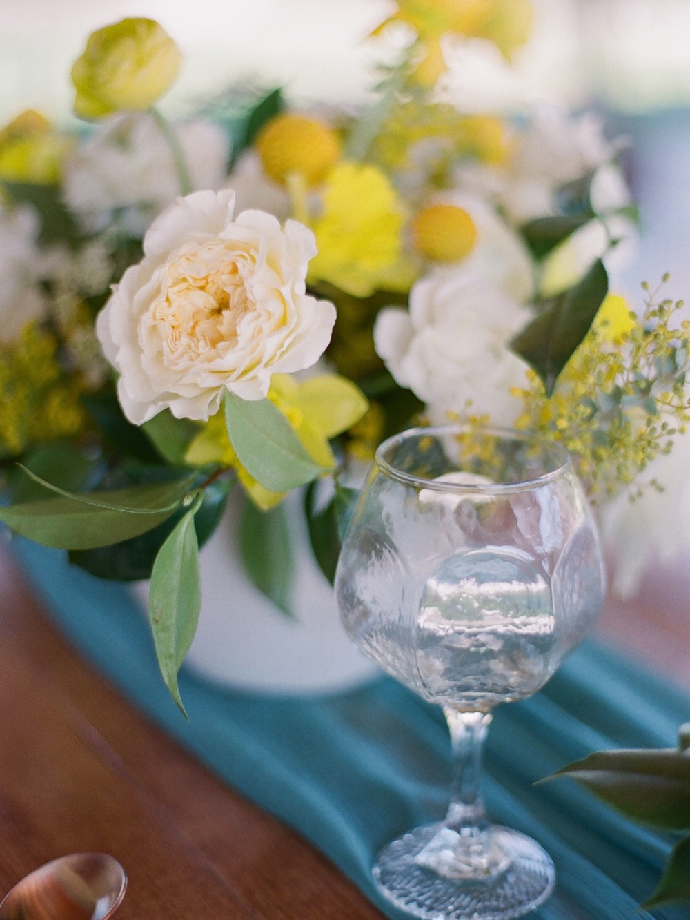 bright yellow white and teal wedding table