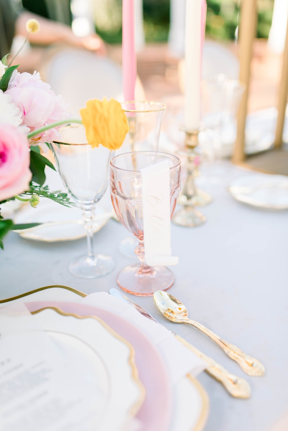 Elegant wedding table setting with pink flowers candles