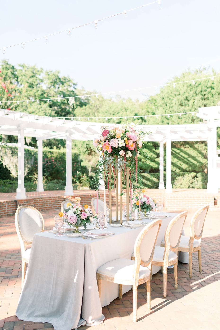 Outdoor wedding reception table with floral centerpiece
