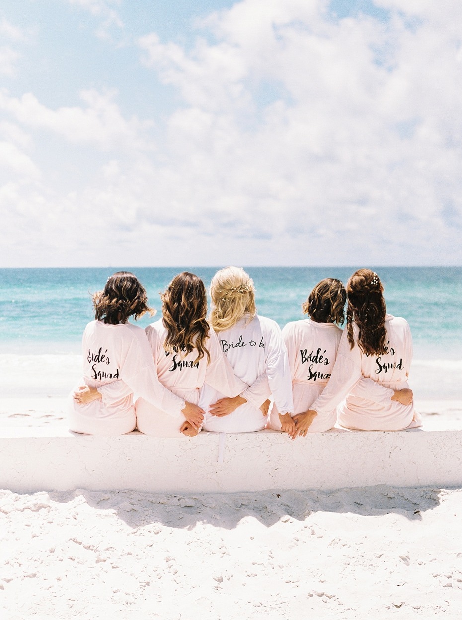a bridal party on the beach