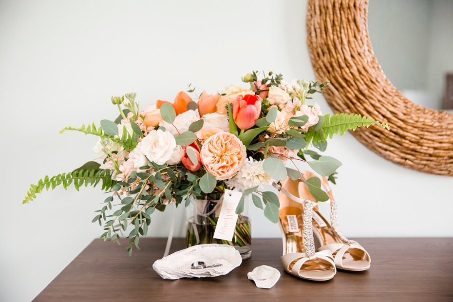 Elegant bridal details featuring flowers and wedding shoes