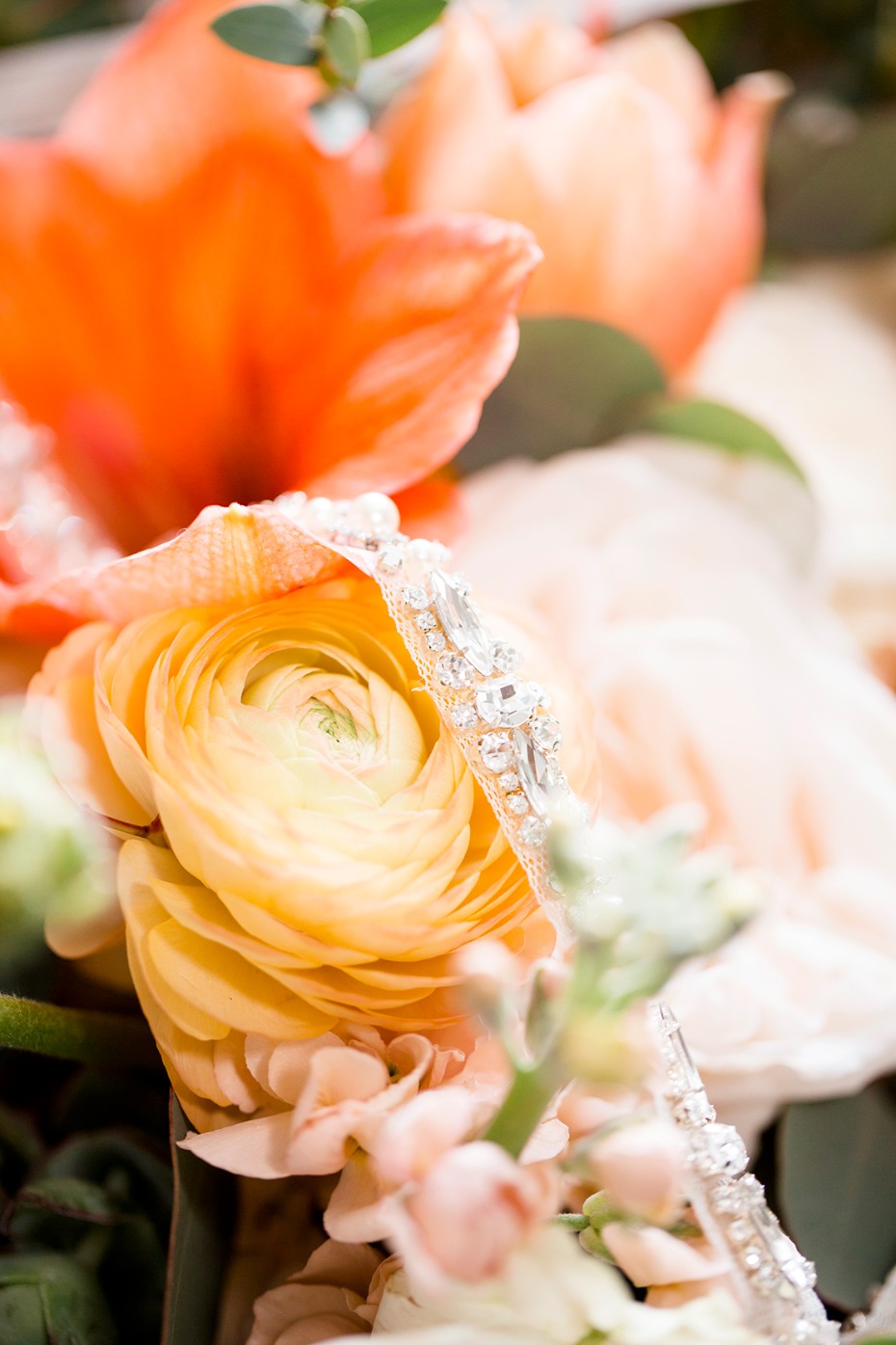 Bridal headband resting on peach and orange flowers