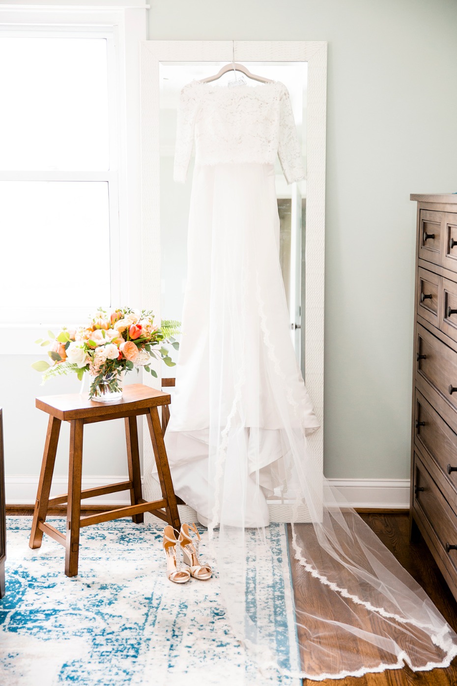 Elegant bridal gown ready for the big day with shoes and bouquet