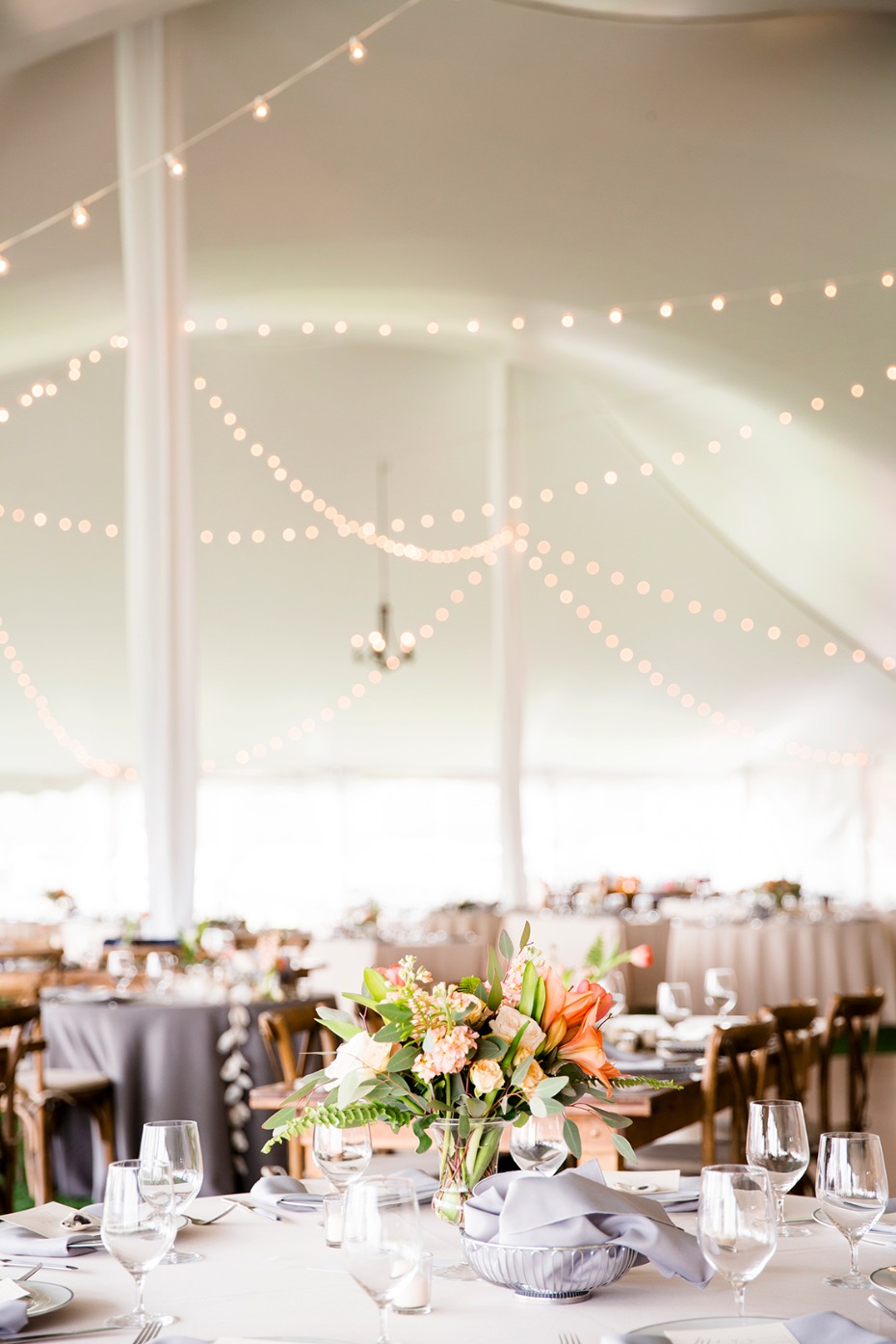 Wedding reception table setting with floral centerpiece
