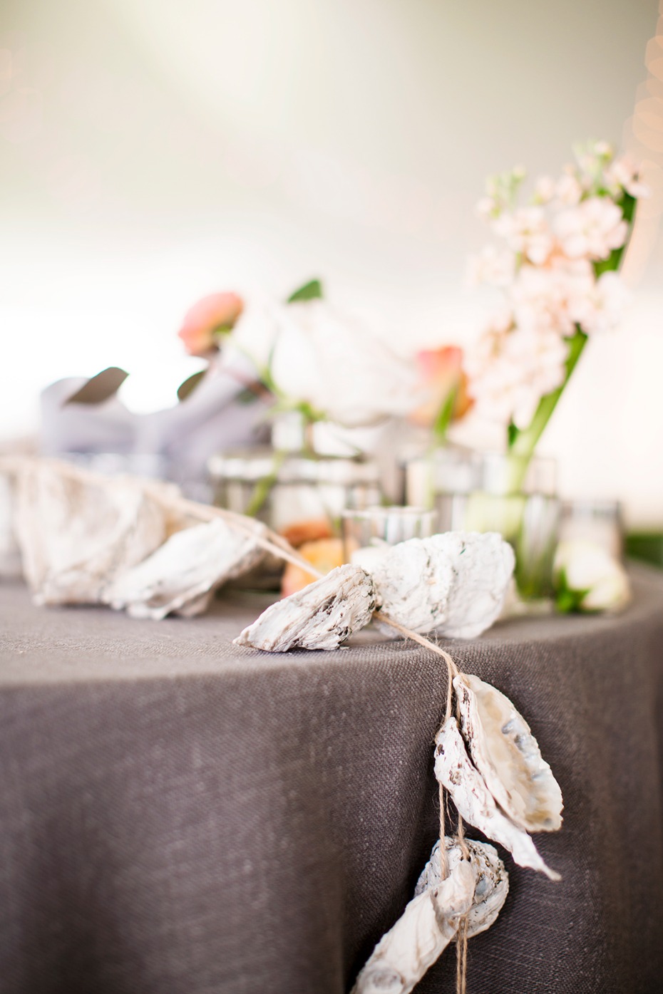 Oyster shell garland on rustic wedding table decor
