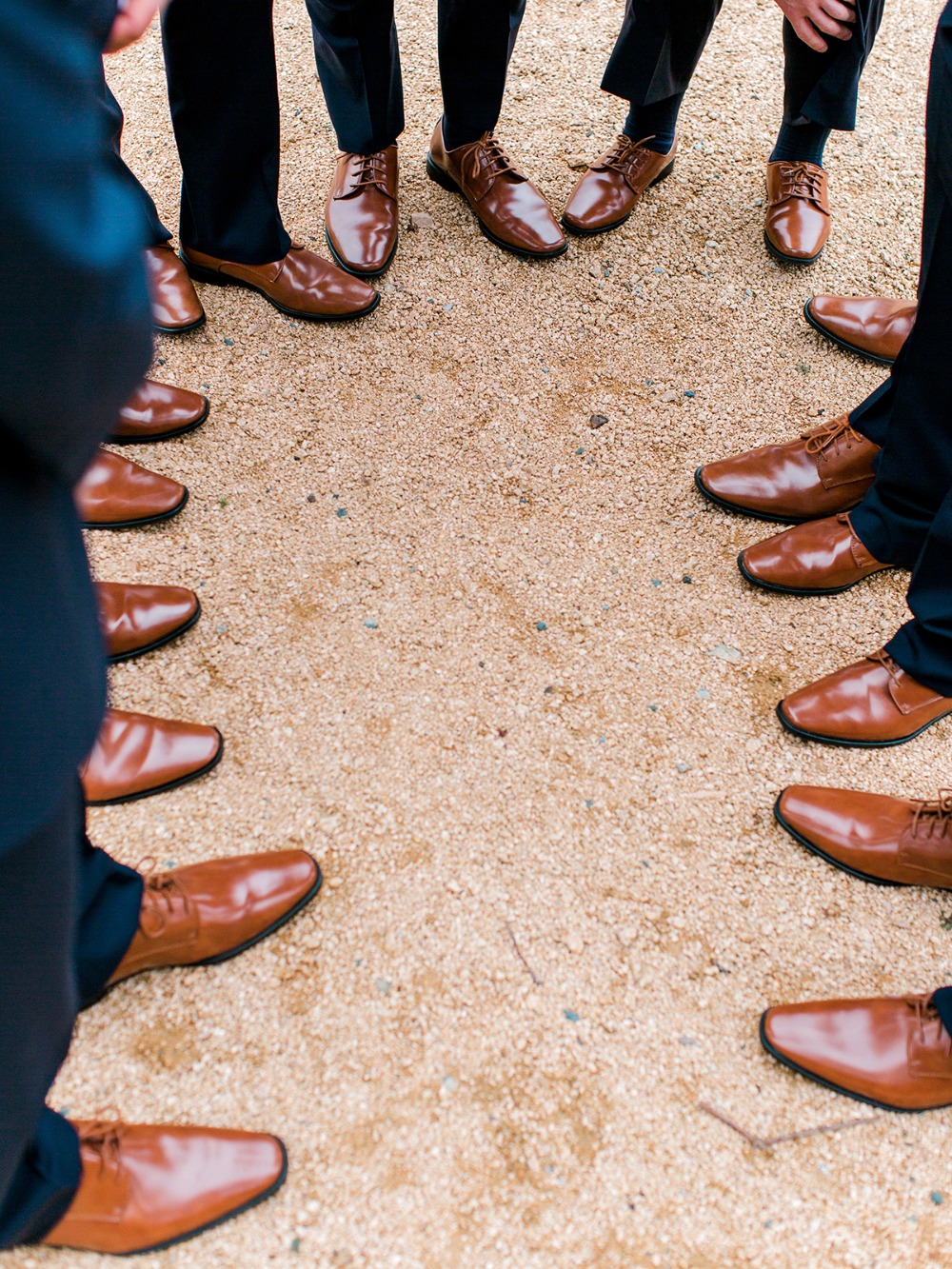 A circle of brown shoes on the ground for a special occasion