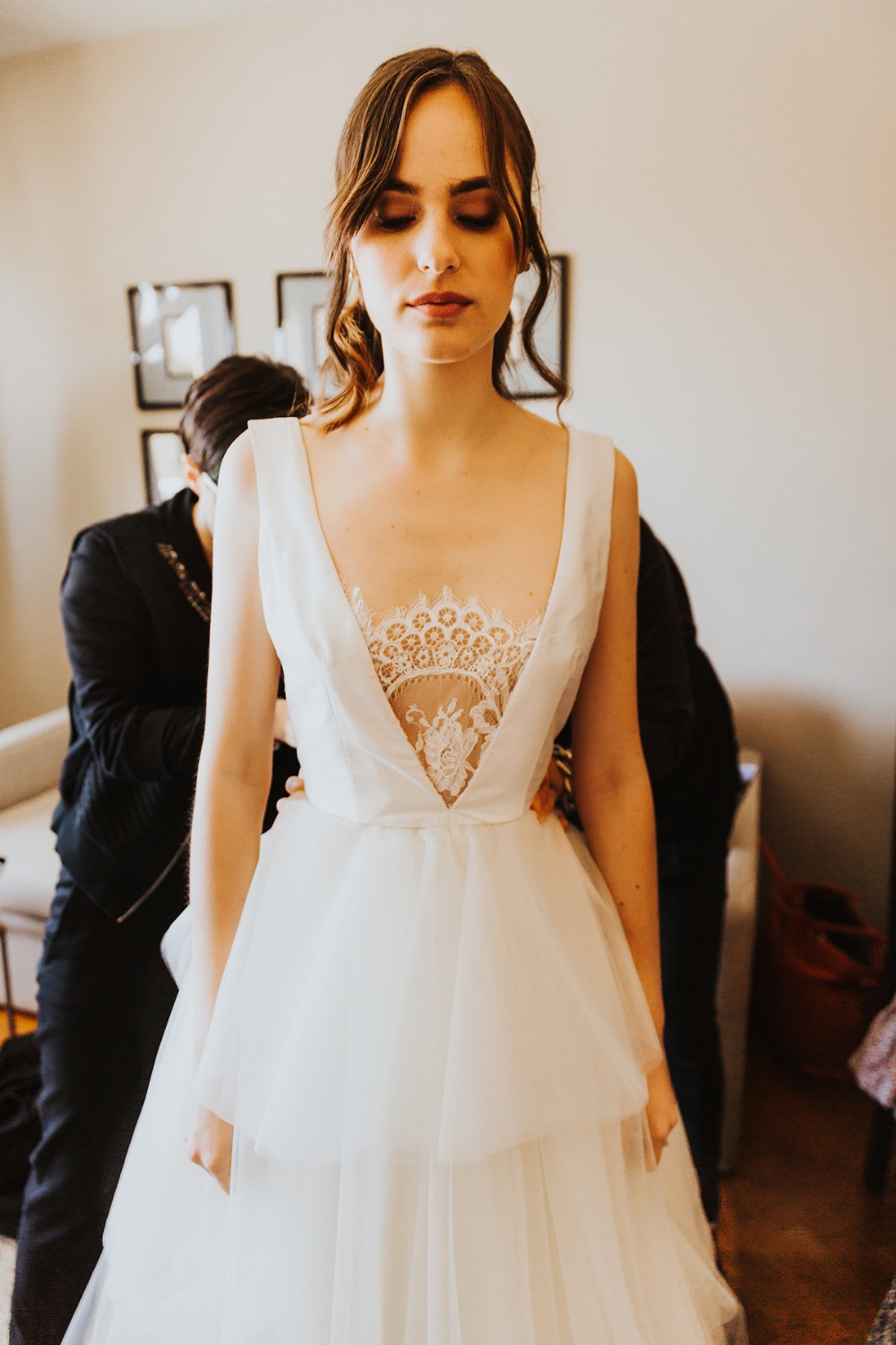 Bride getting ready in wedding dress before the ceremony