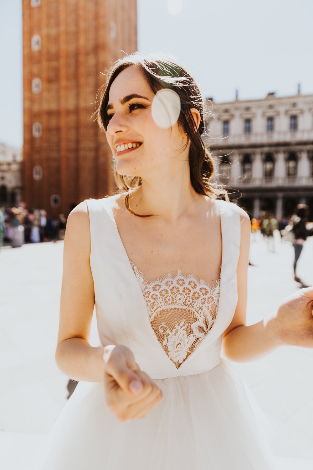 Bride smiling brightly in Venice wearing a beautiful wedding dress