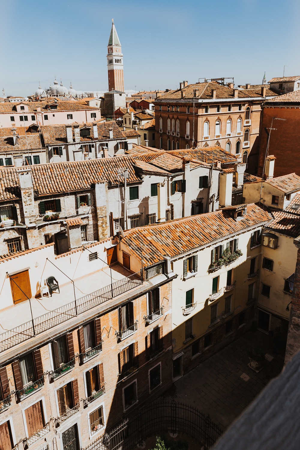 Venice rooftops and St Marks Campanile under a bright blue sky